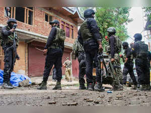 Baramulla: Security personnel at the site of an encounter with militants, in J &...