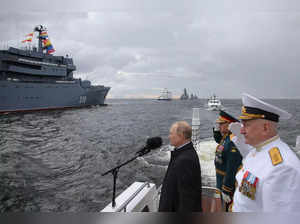 Russian President Vladimir Putin, left, Russian Defense Minister Sergei Shoigu, ...