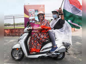 New Delhi: Union Minister Smriti Irani rides a scooty during a âTiranga Bike Rally', at India Gate in New Delhi on Wednesday, August 03, 2022. (Photo: Wasim Sarvar/IANS)