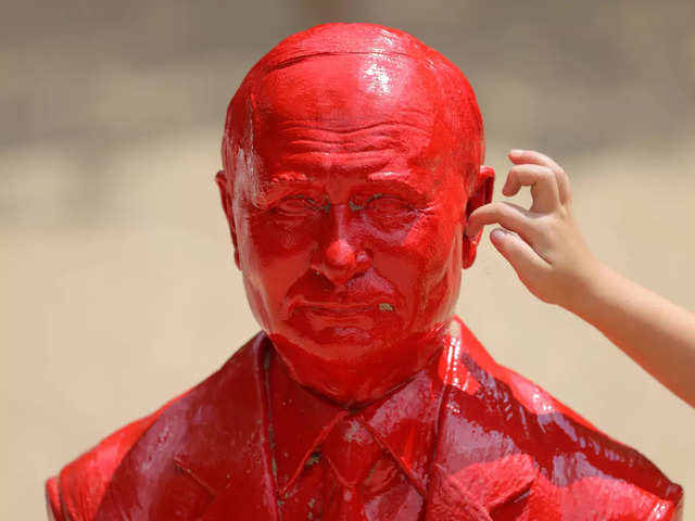 Red statue of Putin