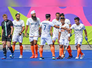 Birmingham: India's Harmanpreet Singh celebrates with teammates after scoring a ...