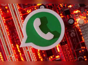 FILE PHOTO: A 3D printed Whatsapp logo is placed on a computer motherboard