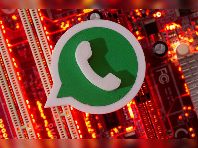 FILE PHOTO: A 3D printed Whatsapp logo is placed on a computer motherboard