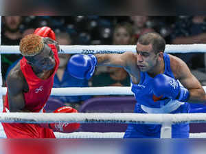 Birmingham: India's Amit Panghal (blue) lands a punch on Zambia's Patrick Chinye...