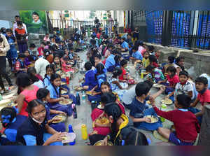 Bengaluru: Children have mid-day meal at a government school in Bengaluru.(PTI P...