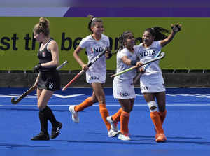 India's Tete Salima, right, celebrates with her team player after scoring a goal...