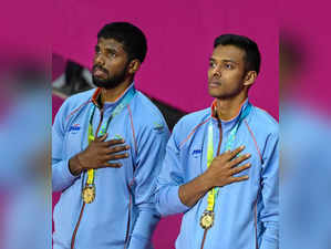 Birmingham: Gold medallists India's Satwiksairaj Rankireddy (L) and Chirag Shett...
