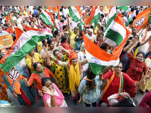 New Delhi, July 21 (ANI): Bharatiya Janata Party (BJP) supporters holding party ...