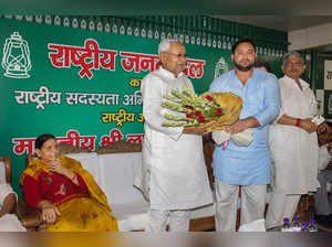 Patna: Janata Dal (United) leader Nitish Kumar being greeted by Rashtriya Janata...