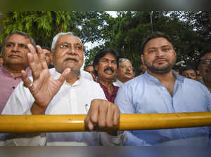 Janata Dal (United) leader Nitish Kumar with Rashtriya Janata Dal leader ...