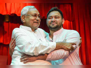 Patna: Bihar Chief Minister Nitish Kumar being greeted by Deputy Chief Minister ...