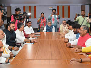 Patna: Union Minister Giriraj Singh and BJP MP Sushil Kumar Modi with others dur...