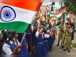 Bengaluru: Students wave national flags during 'Azadi Ka Amrit Mahotsav' celebra...