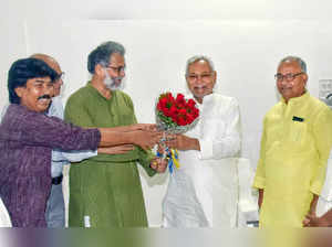 Patna: Bihar Chief Minister Nitish Kumar being greeted by Communist Party of Ind...