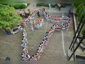 Varanasi :Students form a human chain in displaying an Indian Map as part of "Azadi ka Amrit Mahotsav" ahead of the Independence Day in Varanasi on Saturday August 13,2022.(PHOTO:IANS)
