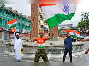 Srinagar: People wave the tricolour celebrating the 76th Independence Day, at Gh...