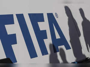 FILED  PHOTO- 06 January 2020, Egypt, Giza: The shadows of spectators can be seen on a FIFA banner.  (Photo: Omar Zoheiry/dpa/IANS)