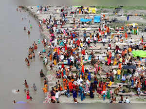 Prayagraj, Aug 11 (ANI): Devotees take a dip in the Ganga river on the occasion ...