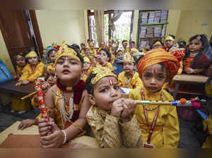 Patna: Students dressed as Lord Krishna celebrate the Janmashtami festival at a ...