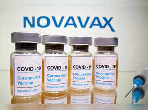 FILE PHOTO: FILE PHOTO: FILE PHOTO: Vials and medical syringe are seen in front of Novavax logo in this illustration