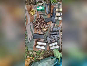 Jammu : A huge cache of arms and ammunition have been recovered by the police after the disclosures made by Lashkar-e-Taiba commander Talib Hussain, who was caught by the villagers of Tukson Dhok village in Jammu and Kashmir's Reasi district along with his accomplice, on Monday, July 04, 2022.(Photo: Nisar Malik /IANS)