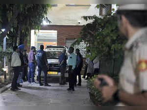 New Delhi: Central Bureau of Investigation (CBI) officials leave after a raid at...