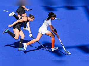 Birmingham: India's Sharmila Devi runs with the ball during the women's hockey b...