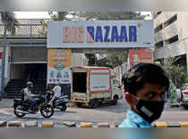People move past a Future Retail's closed Big Bazaar retail store in Mumbai