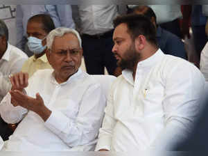Patna: Bihar Chief Minister Nitish Kumar in a conversation with Deputy CM Tejashwi Yadav during laying the foundation stone of the Patna Metro Rail Project's underground construction work, in Patna, Thursday, Aug 18, 2022 (Photo: IANS)