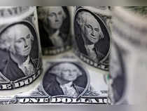 Dollar eases from near two-decade peak as Jackson Hole looms