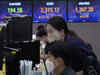 Asian markets gain, investors anxious for US rate hike clues