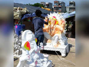Amritsar: An artisan paints an idol of Lord Ganesha at a workshop ahead of the Ganesh Chaturthi festival, in Amritsar on August 24, 2022. (Photo:Pawan sharma/IANS)