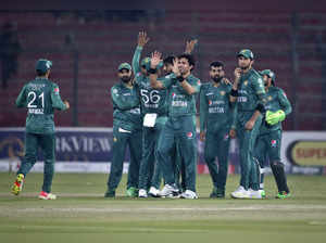 Karachi : Pakistan's Mohammad Wasim, center, and teammates celebrate the dismiss...