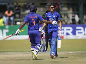 Indian batsman Shubman Gill celebrates after scoring 100 runs on the last day of...