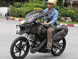 A motorcycle made from recycled materials of spare parts from cars and bicycles