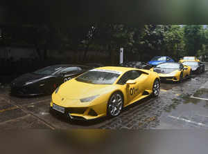 Kolkata: Lamborghini super sports cars stand in a queue before the start of Lamb...