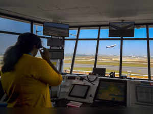 Chennai: A woman employee operates at the Air Traffic Control System on Internat...