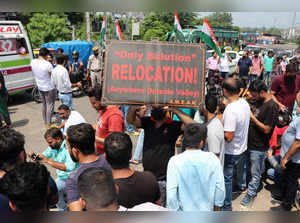Jammu: Kashmiri Pandits migrants hold placards and shout slogans during their protest for their safe relocation after the series of suspected target killings in Kashmir Valley, in Jammu on Wednesday, August 17, 2022. (Photo: Jaipal Singh/IANS)
