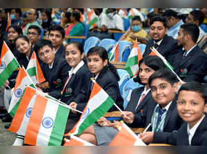 New Delhi, Aug 12 (ANI): Students holding National flags attend the felicitation...