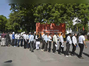 New Delhi: Teachers wait in a queue to enter the Vigyan Bhawan for the Teachers'...
