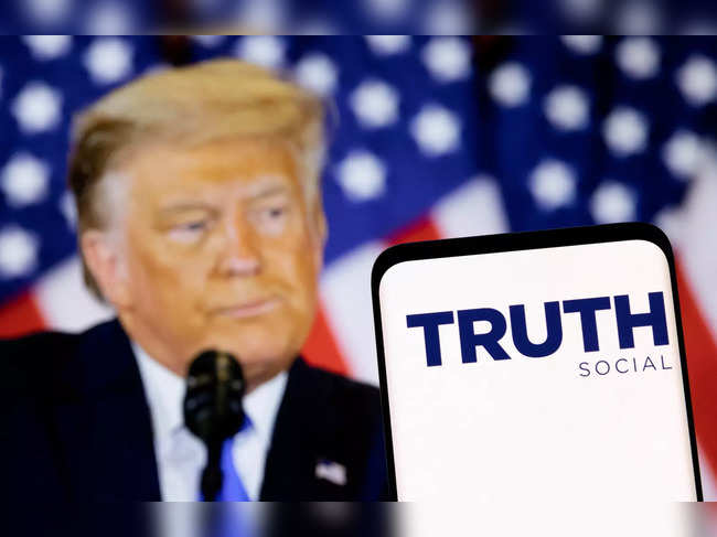 FILE PHOTO: Illustration shows Truth social network logo and display of former U.S. President Donald Trump