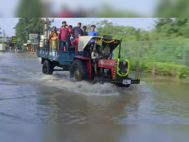 ​People commute in tractors in Bengaluru