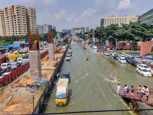Bengaluru: Vehicles pass through the waterlogged Outer Ring Road at Bellandur in...