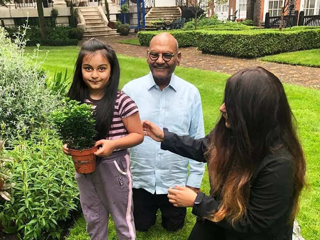 ​Anil Agarwal gardening with his daughter Priya and granddaughter Mahii​.