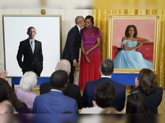 Obamas return to the White House, unveil official portraits