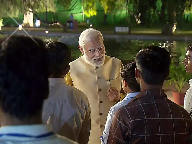 ​PM interacts with workers
