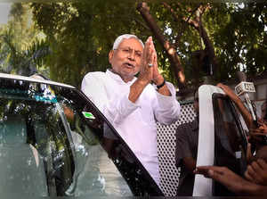 New Delhi: Bihar Chief Minister Nitish Kumar gestures at the media as he leaves ...
