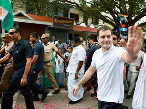 Congress leader Rahul Gandhi waves to the crowd on...