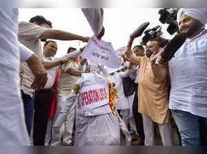 New Delhi: AAP MLAs protest demanding a probe into the alleged 'Operation Lotus'...