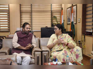 Union Women and Child Development Minister Smriti Irani with former u...